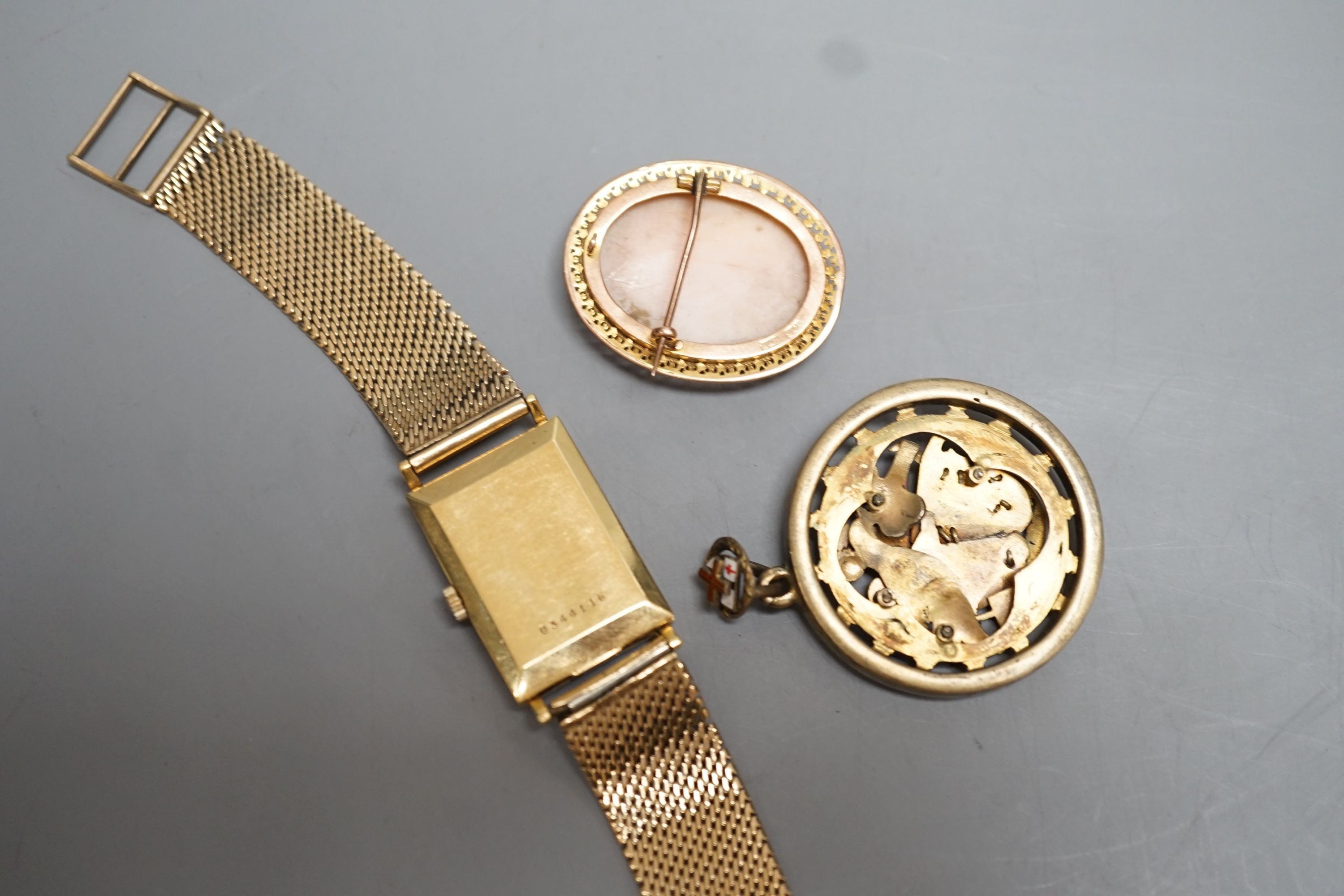 A gentleman's 18ct Marvin manual wind wrist watch, on a 9ct gold bracelet, gross 38.4 grams, a 9ct mounted oval cameo brooch cameo brooch and an enamelled gilt metal medallion.